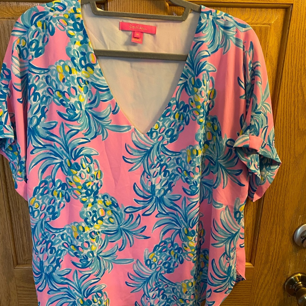 Lilly Pulitzer Vibrant Pink and Blue top. This item runs one size larger.